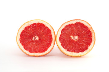 Slices of grapefruit macro closeup on white background