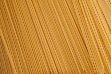 Raw spaghetti on a gray background