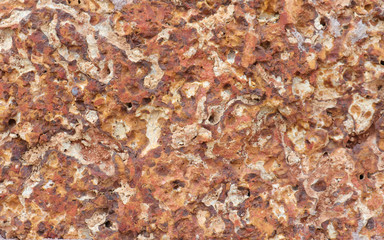 The old stone surface with rough and decay marks over time