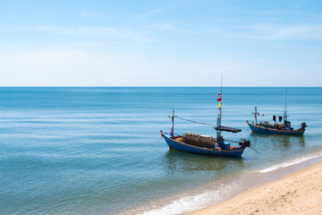Naklejka na ściany i meble boats on the beach, sea, summer, fresh sky Used to make travel text websites