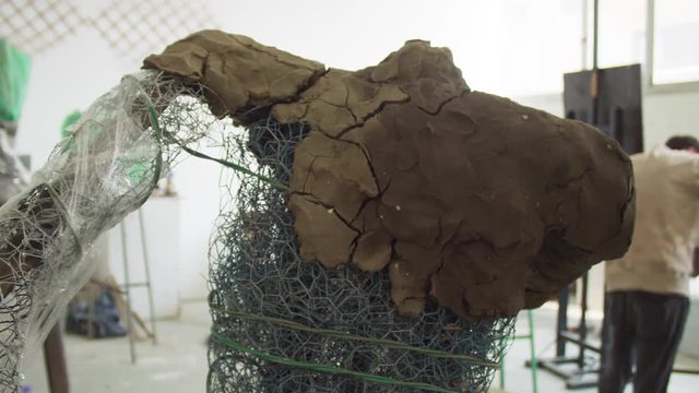 Sculpture in art university atelier workshop. Shot on Red camera.