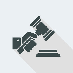 Hand holding a judge gavel