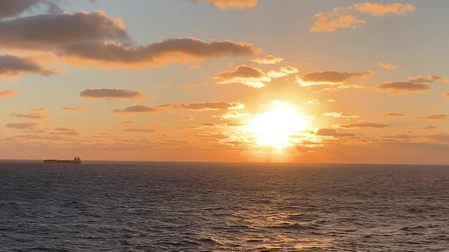 Beautiful golden sunrise over the open seas with copy space	