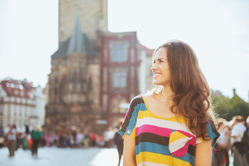 smiling trendy woman in Prague Czech Republic sightseeing