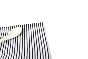 Black and white tablecloth Ceramic plate on white background.