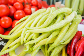 healthy green chili peppers on market