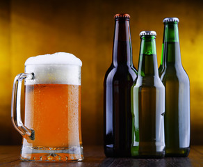 Composition with glass and bottles of beer