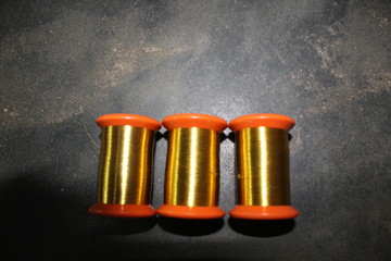 Metal and wooden silk thread