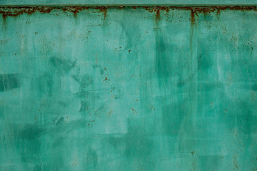 Green metal dirty sheet fence. Rust grunge leaks template blank. Old paint on the fence. Copper...