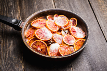 Making jam with red oranges. Selective focus. Shallow depth of field.
