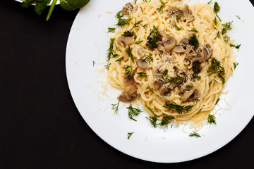 Delicious dinner or lunch on a black wooden background, close-up