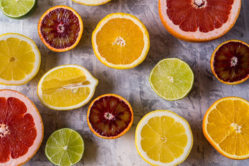 Flat lay view of slices different raw fresh citrus fruit.