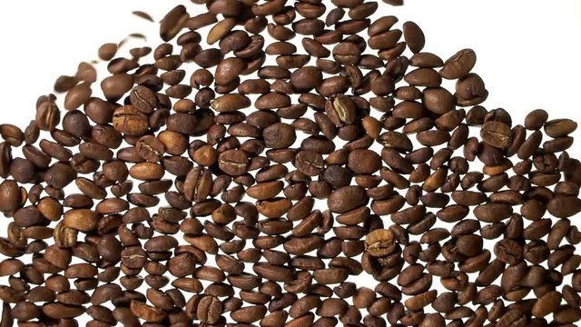 Roasted brown coffee beans filling up the screen space falling down on white backgound.