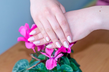 Beauty woman hands with pink fashion manicure.