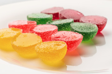 Colorful jelly marmalade sweets in a white plate