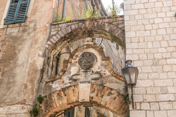 Typical facade of an old building in the narrow medieval streets in the old town of Kotor, Montenegro