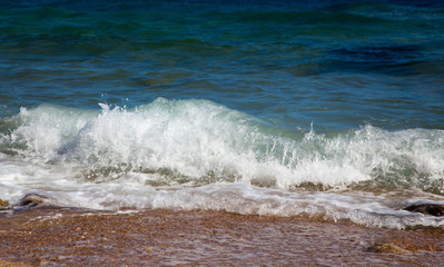 Waves in the ocean. Beautiful blue sea wave photograph close up. Beach vacation at sea or ocean. Background to insert images and text. Tourism, travel.