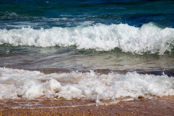 Waves in the ocean. Beautiful blue sea wave photograph close up. Beach vacation at sea or ocean. Background to insert images and text. Tourism, travel.