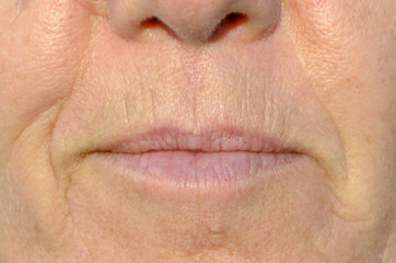 Close up on the mouth of a middle-aged woman