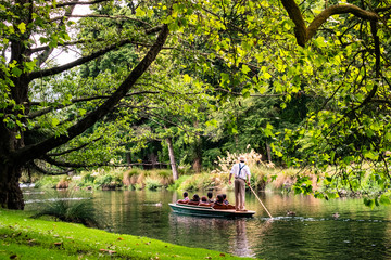 2018, DEC 22 - New Zealand, Christchurch, People are enjoing on the boat on the river in Botanic garden. - obrazy, fototapety, plakaty