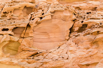 texture of orange stone rock in a colored canyon close up