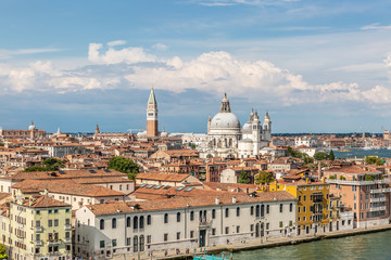 Fototapeta na wymiar View of ancient buildings and the Basilica di Santa Maria della Salute in Punta della Dogana in Venice