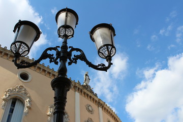 Fototapeta na wymiar street lamp on background of blue sky