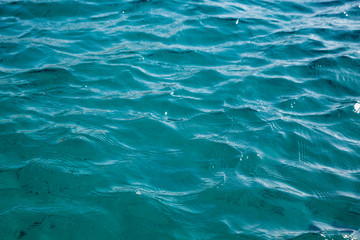 Beautiful coastline with sand and water. blue sea wave photograph close up. vacation at sea or ocean. Background to insert images and text. Tourism, travel.