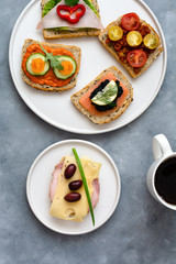 Breakfast toasts with various toppings. Healthy bruschetta. Bread sandwich.