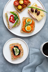 Breakfast toasts with various toppings. Healthy bruschetta. Bread sandwich.