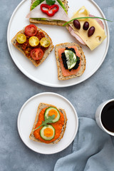 Breakfast toasts with various toppings. Healthy bruschetta. Bread sandwich.
