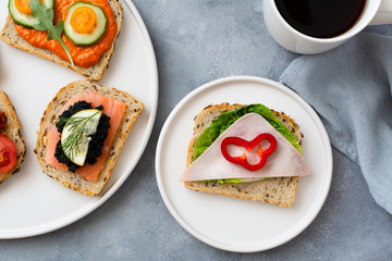 Breakfast toasts with various toppings. Healthy bruschetta. Bread sandwich.