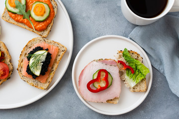 Breakfast toasts with various toppings. Healthy bruschetta. Bread sandwich.
