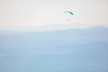 free flight with parachute over the mountains