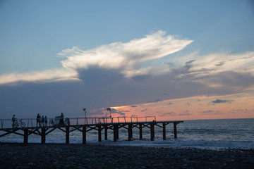 Fototapeta na wymiar sun setting over Terrace dock or pier. Dock sea and cloudy sky background. sunset