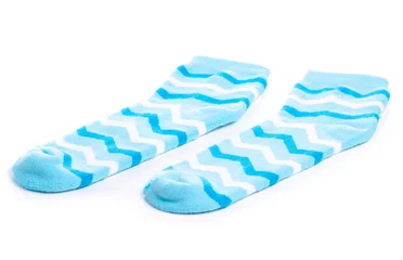 Rolgordijnen Pair blue sock on white background isolation © Kabardins photo