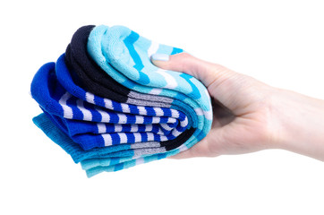 Blue socks in hand on white background isolation