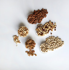 Healthy food. Nuts mix assortment on stone table top view. Collection of different legumes for background image close up nuts, pistachios, almond, cashew nuts, peanut, walnut. image