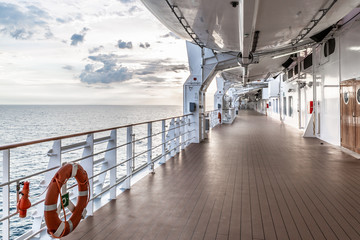 Perspective view of outdoor deck at a cruise ship with sea in the background