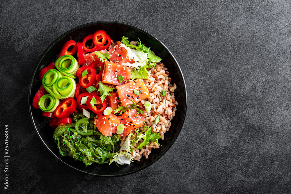 Canvas Prints poke bowl of brown rice, trout or salmon fillet, chuka seaweed salad, sesame and fresh vegetables on