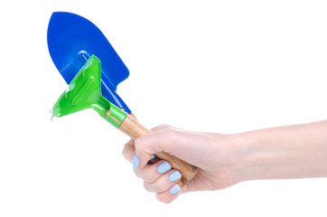 Set of garden rake and shovel in hand on white baclground isolation