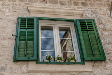 Beautiful green window of an old and typical Italian house