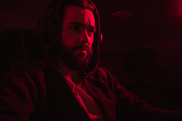 Bearded hacker in dark room