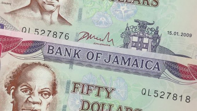 Jamaica dollar bills rotating. Jamaican currency, money. 4K stock video footage