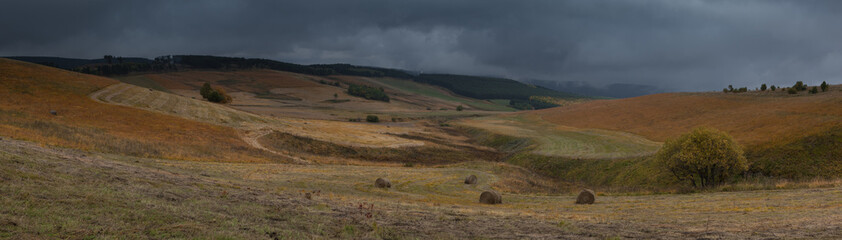 Russia, the Caucasus Mountains, Kabardino-Balkaria. Storm clouds over the sloping meadows in the mountains.