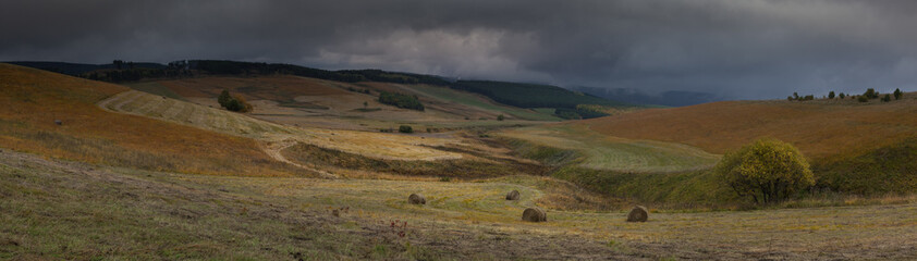Russia, the Caucasus Mountains, Kabardino-Balkaria. Storm clouds over the sloping meadows in the mountains.