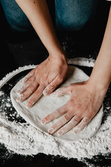 chef hands knead dough