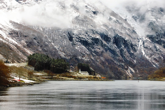 Nature and tiny church are fully preserved from environmental threats in dramatic landscapes of Naeroyfjord, Norway
