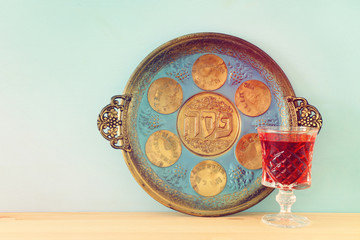 Pesah celebration concept (jewish Passover holiday). Translation for Hebrew Text over plate: (PESAH) PASSOVER