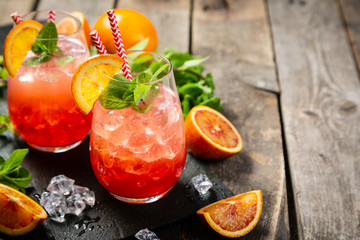 Bloody orange drink and ingredients, copy space